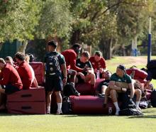 Players relax after the British &amp; Irish Lions training session held at Hale School yesterday...