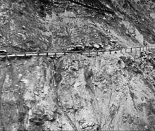 An awkward moment on the Kawarau Gorge road between Arrowtown and Gibbston (future SH6) as cars...
