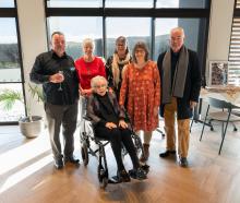 Olive, Lady Hutchins, pictured on her 100th birthday on Saturday in Queenstown, surrounded by her...
