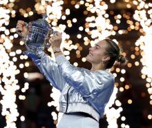 Belarus' Aryna Sabalenka celebrates with the trophy after winning the women's singles final....