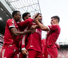 Dominik Szoboszlai of Liverpool celebrates with his teammates after scoring in their 1-0 win over...