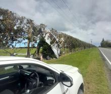 Roofing material blown across Oxford Rd. Photo: Waimakariri District Council 