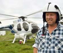 Lister Helicopters owner pilot Alister Lister in front of his helicopter in Toko Mouth. PHOTOS:...