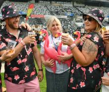 Andi Hickey (centre), of Beer Baroness Christchurch, gets up close with the Dunedin Pink...