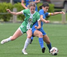 Central's Scarlett McIvor (left) tries to edge out Southern United captain Rose Morton during...