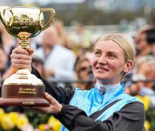 Jamie Melham celebrates winning the Melbourne Cup on Tuesday. Photo: Getty Images
