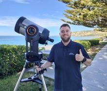 Bradley McConville sets up his solar telescope along the Kaikōura beachfront for viewing the sun....
