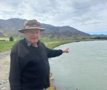 Omarama farmer Ginger Anderson shows where the Ahuriri River is cutting into his family’s...
