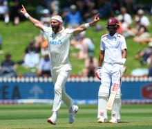 Black Caps bowler Michael Rae celebrates taking a wicket during day one of the second test match...