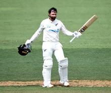 New Zealand's Devon Conway celebrates reaching his century against the West Indies in Mount...