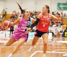 Tauranga Whai guard Jessica McDowell-White (left) tries to get around Mainland Pouakai defender...