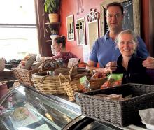Hyde Hotel owners Craig and Liz Alderson catch a moment together between customers while daughter...