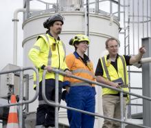 Discussing their work at the Tahuna wastewater treatment plant are (from left) plant supervisor...