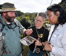 Otago Anglers Association president Mark Barrett shows a rabbit tail streamer fly to Carrie...