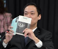 Dunedin city councillor Benedict Ong presents his defence in a code of conduct case, reading from...