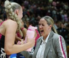 Southern Steel defender Carys Stythe celebrates with head coach Wendy Frew after their 69-60...
