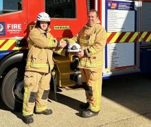 Newly appointed Oamaru Volunteer Fire Brigade Deputy Chief Fire Officer Tane Rogers (right) is...