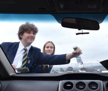 Trying out their Winter Warriors windscreen concoction are Taieri College students (from left)...