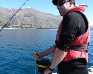 Environmental officer Nathan Manning uses a hydro-lab to measure the pH and oxygen levels of the...