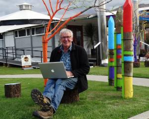 Award winning New Zealand landscape photographer and author Andris Apse, in Wanaka this week, prepares for his Festival of Colour talk at the Crystal Palace last night. Photo by Kerrie Waterworth.