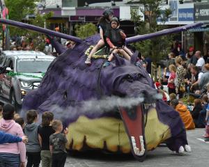 A creative creature gets fired up at the parade.