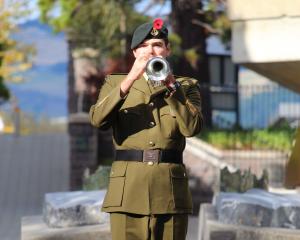 Trumpeter Tom Oldham plays the Last Post during the Otago University Students' Association Anzac...