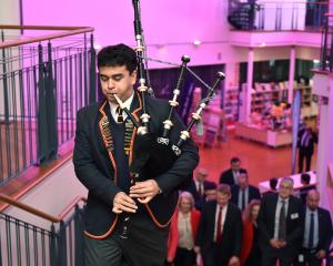 John McGlashan College pupil and Class Act recipient Qwenton McKenzie plays the bagpipes to...