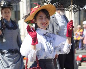 Walking in the Grand Street Parade is Fiorella Leaw, of Malaysia. PHOTOS: ARROW KOEHLER