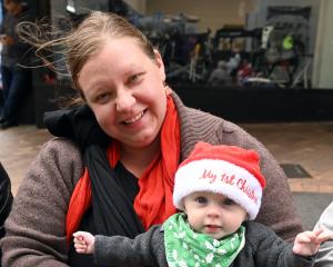 Elizabeth Ferguson of Dunedin and her daughter Amelia Thornton, 7 months, watch the parade.