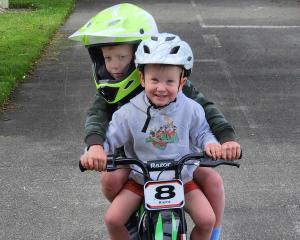 Look out! . . . Spencer Bell, 6, and Noah Bell, 2, ride their shared Christmas present in Gore....