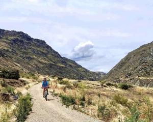 Riding along . . . Jess Courtney cycles the Roxburgh Gorge trail between Alexandra and Doctors...