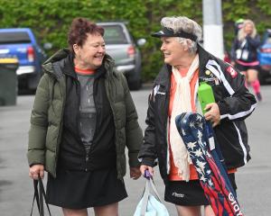 Nellie McDonald, 74 (left), and Dianne Foley, 77, both of Auckland, carry their gear before their...