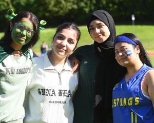 Feeling the spirit of the day are (from left) Gunit Kaur, 17, Rawaa Allo, 18, Hala Alsaayde, 18,...