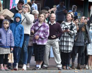 Proud family members watch their loved ones make their way to the ceremonies yesterday. PHOTO:...