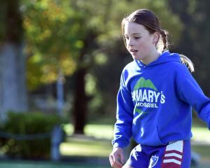 Billie Meddings, 10, of St Mary’s School, tries out some football skills. PHOTOS: PETER MCINTOSH