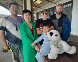 Oamaru Railway Station owners Jared Yuan (left) and Tina Wang, with their son Jayden, 4, were...