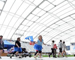 Participants in the Dunedin Relay for Life fundraiser complete laps at Forsyth Barr Stadium on...