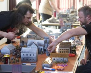 Zach Neal (left), of Christchurch, and Aidan Haig, of Oamaru, play Warhammer 40,000 at the...