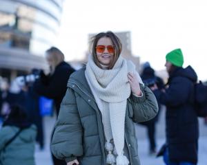 A guest wears a full-length khaki puffer jacket during the Copenhagen Fashion Week earlier this...