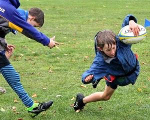 A little moisture did not stop Clinton School’s Axel Wilson, 7, going for glory. PHOTOS: NICK...