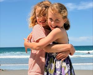 Best friends Harriet Laing and Frida Zollman, both 8, reunite at St Clair Beach on December 27....