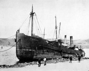 The Union Steam Ship Company's Kowhai, lying on the beach at the Spit, opposite Harington Point,...