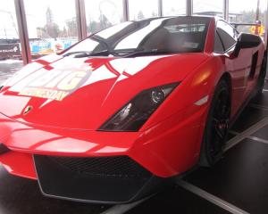A bright red Lamborghini Gallardo is on offer for people to admire in Queenstown as part of the ...