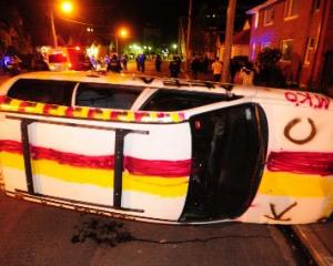 A car lies overturned in Castle St on Friday. Photo by Craig Baxter