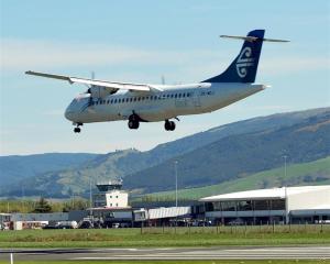 A flight lands at Dunedin Airport. Photo by ODT.