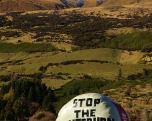 A hay bale in Glenorchy spreads a message of opposition to the proposed  Milford Dart  tunnel....