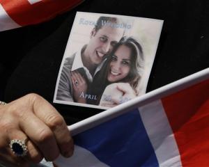A picture of Prince William and Kate Middleton is seen on the T-shirt, and a ring similar to that...