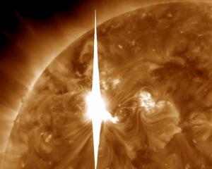 A solar flare heads toward Earth in this NASA image. Scientists say the flare may cause a...