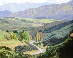 Acclaimed artist Dick Frizzell, of Auckland, stands beside The Road West to Lawrence (2012), one...