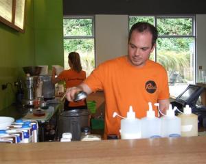 Alex Grant whips up a Frozen Monkey Relapse in the blender. Photo by Christina McDonald.